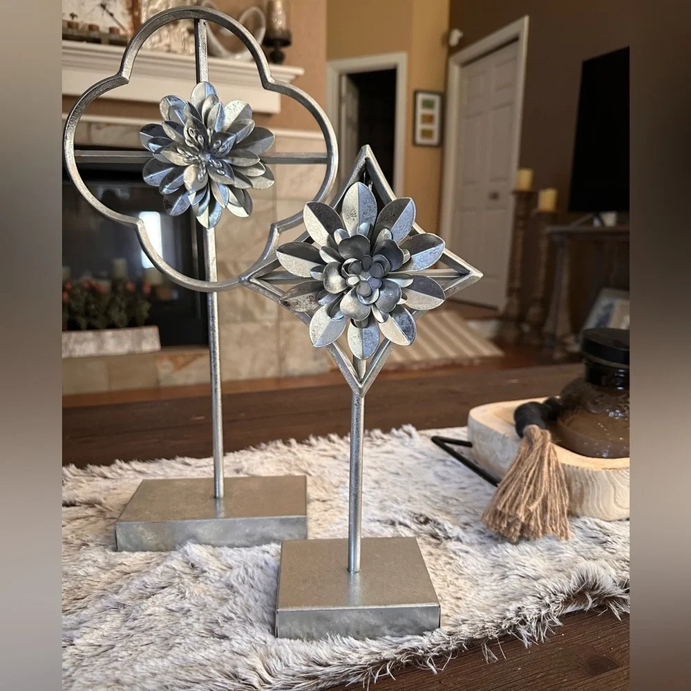 Home decor accents  two silver flowers on pedestal stand